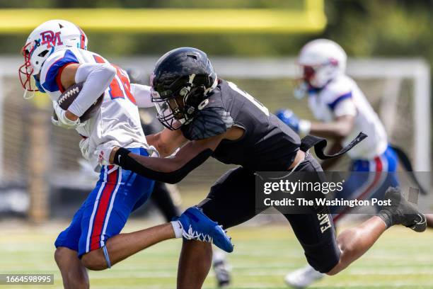 Freedom running back Jeffrey Overton tackles DeMatha's Vincent Ordenes during a high school football game on Saturday, September 9, 2023. The game...