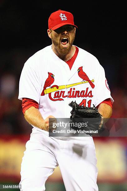 Reliever Mitchell Boggs of the St. Louis Cardinals reacts after recording the final out of the game against the Milwaukee Brewers at Busch Stadium on...