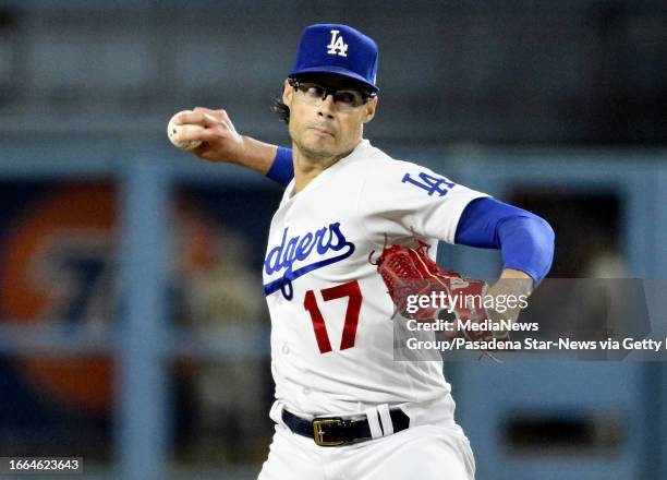 Los Angeles, CA Relief pitcher Joe Kelly of the Los Angeles Dodgers throws to the plate against the San Diego Padres in the seventh inning of a...