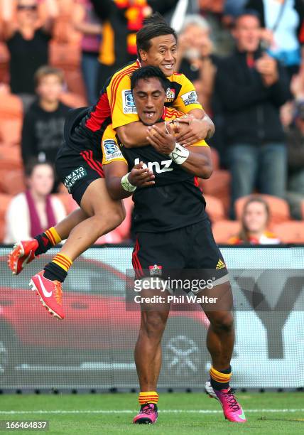 Tim Nanai-Williams of the Chiefs congratulates Bundee Aki of the Chiefs on his try during the round nine Super Rugby match between the Chiefs and the...