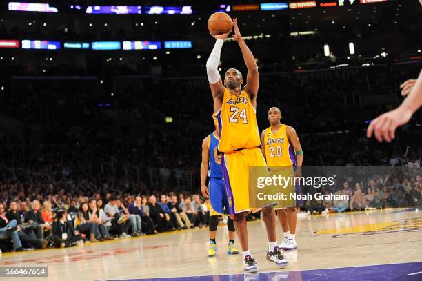 Kobe Bryant of the Los Angeles Lakers shoots a free-throw after sustaining an injury during a game against the Golden State Warriors at Staples...