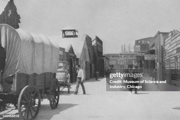 Covered Wagons park alongside the general store in the 49ers Gold Rush exhibit at the Century of Progress International Exposition in Chicago,...