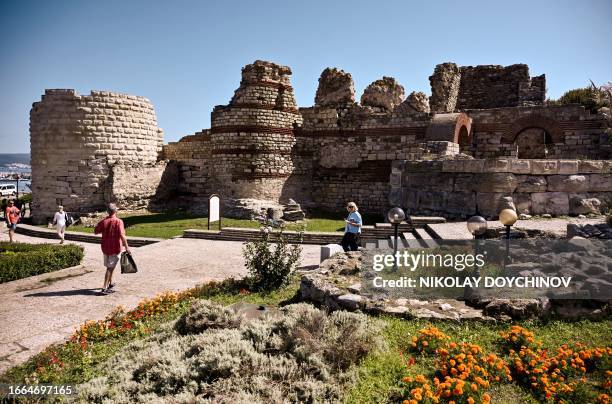 This picture taken on September 13 shows tourists walking in the ancient city of Nessebar, Unesco heritage site.