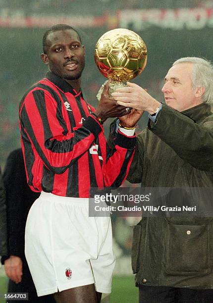 George Weah of AC Milan is presented the 'European Footballer of the Year' award before the Serie A match between AC Milan and Sampdoria held on...
