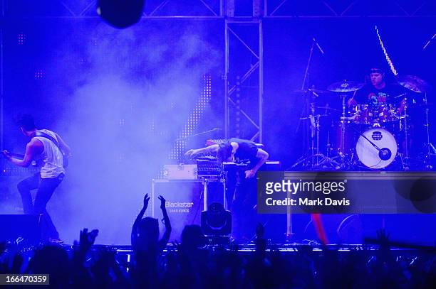 Nick Tsang, Matthew Curtis and Josh Friend of Modestep perform onstage during day 1 of the 2013 Coachella Valley Music & Arts Festival at the Empire...