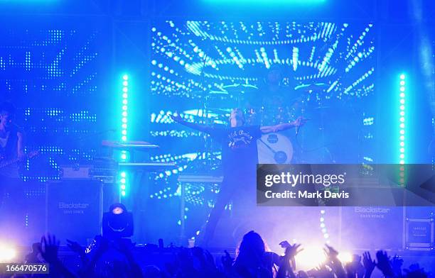 Guitarist Nick Tsang, Drummer Matthew Curtis and Singer Josh Friend of Modestep perform onstage during day 1 of the 2013 Coachella Valley Music &...