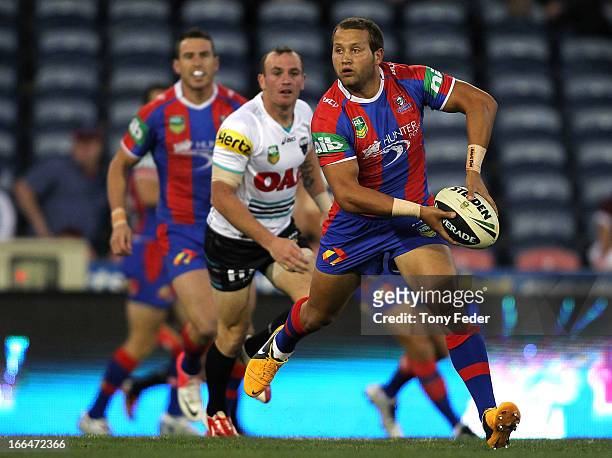 Tyrone Roberts of the Knights passes the ball during the round six NRL match between the Newcastle Knights and the Penrith Panthers at Hunter Stadium...