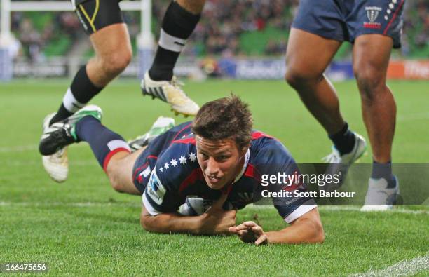 Angus Roberts of the Rebels scores a try during the round nine Super Rugby match between the Rebels and the Kings at AAMI Park on April 13, 2013 in...