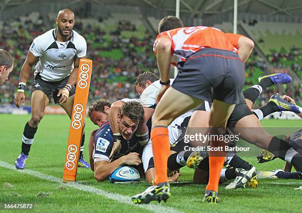 Mitch Inman of the Rebels scores a try during the round nine Super Rugby match between the Rebels and the Kings at AAMI Park on April 13, 2013 in...