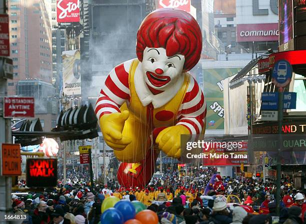 The Ronald McDonald balloon makes his way through Times Square during the 76th annual Macy's Thanksgiving Day Parade November 28, 2002 in New York...