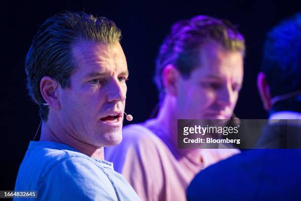 Tyler Winklevoss, co-founder and chief executive officer of Gemini, left, with his brother Cameron Winklevoss, co-founder and president of Gemini,...