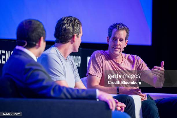 Cameron Winklevoss, co-founder and president of Gemini Trust Co., center, with his brother Tyler Winklevoss, co-founder and chief executive officer,...
