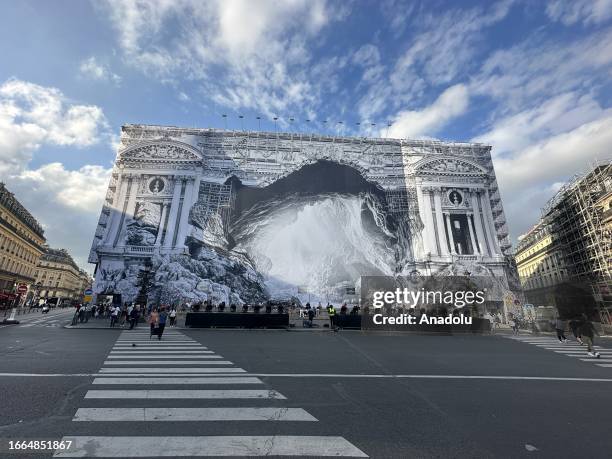 An exterior view of world-famous Palais de Garnier Opera House after it is covered with illustration as restoration works continue in Paris, France...