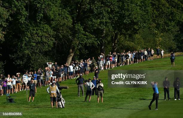 Norway's Viktor Hovland plays a shot from the 4th fairway on day one of the BMW PGA Championship at Wentworth Golf Club, south-west of London, on...