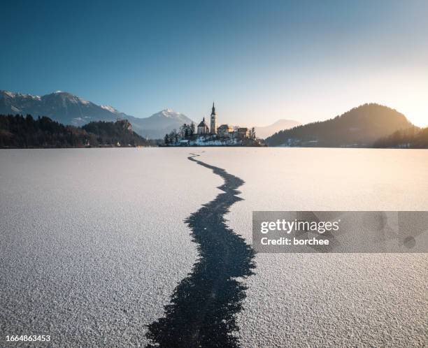 frozen lake bled - slovenia winter stock pictures, royalty-free photos & images