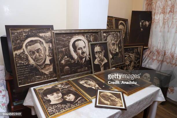 View of the drawings by 71 year-old Azerbaijani amateur painter Huseyin Mirtegevi using the medical scalpels on colored wooden boards in Baku,...