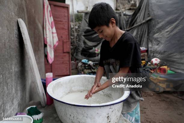 Child washes his hand in Pamplona Alta district, where its inhabitants have been struggling for accessing to clean water during their daily lives, in...