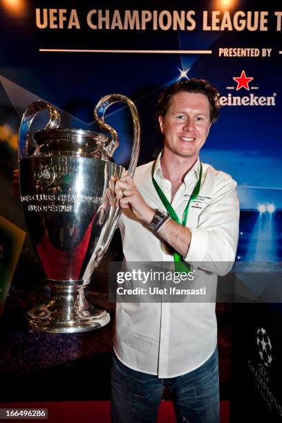 Ambassador Steve McManaman poses with the UEFA Champions League trophy during the UEFA Champions League Trophy Tour 2013 presented by Heineken at...
