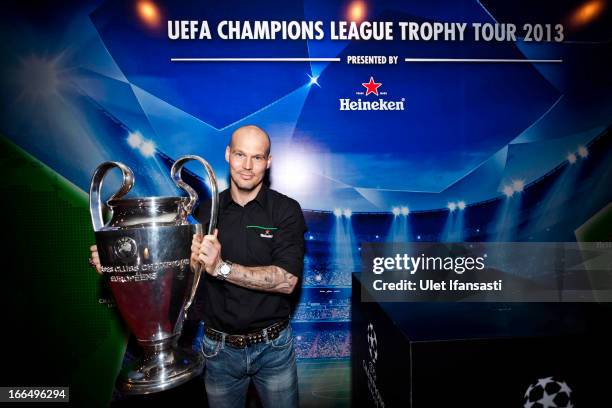 Ambassador Fredrik Ljungberg poses with the UEFA Champions League trophy during the UEFA Champions League Trophy Tour 2013 presented by Heineken at...