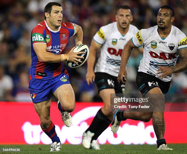 James McManus of the Knights on his way to scoring a try during the round six NRL match between the Newcastle Knights and the Penrith Panthers at...