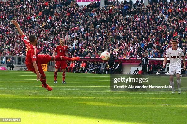 Jerome Boateng of Muenchen scores the opening goal during the Bundesliga match between FC Bayern Muenchen and 1. FC Nuernberg at Allianz Arena on...