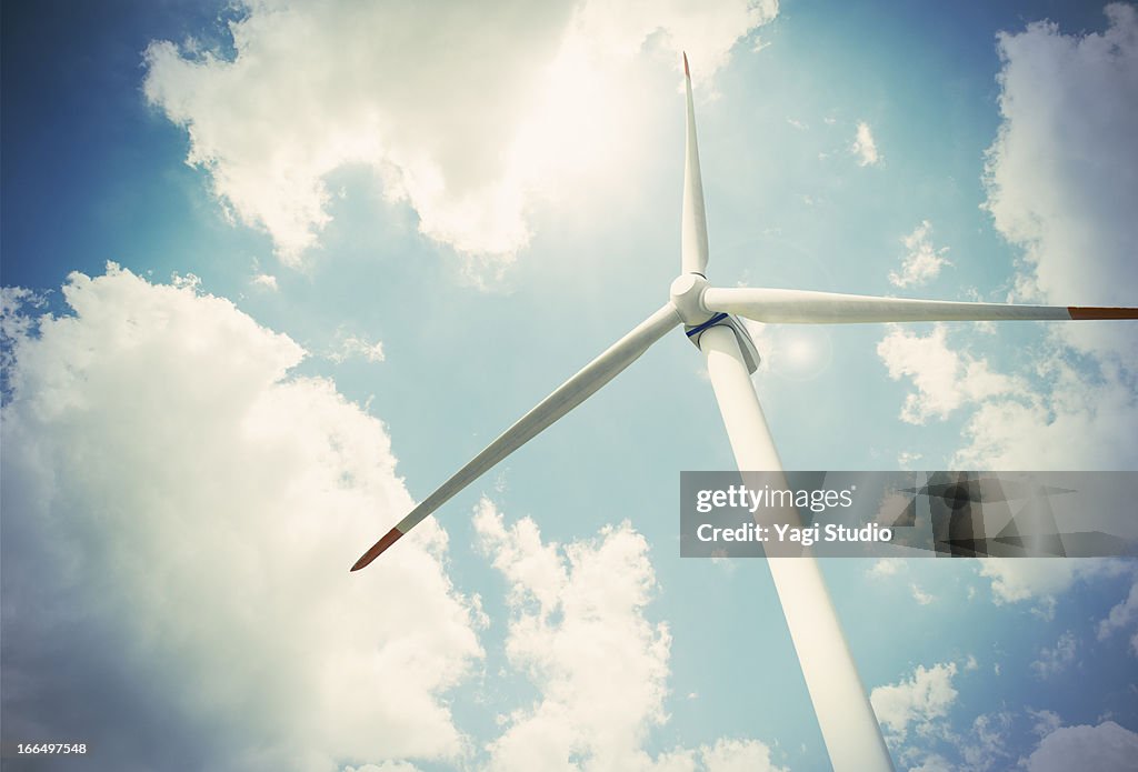 Wind turbine and blue sky, view from below