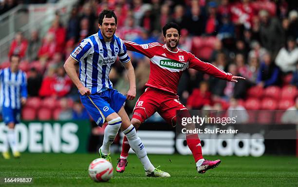 Middlesbrough forward Merouane Zemmama reacts after shooting wide watched by Brighton defender Gordon Greer during the npower Championship match...