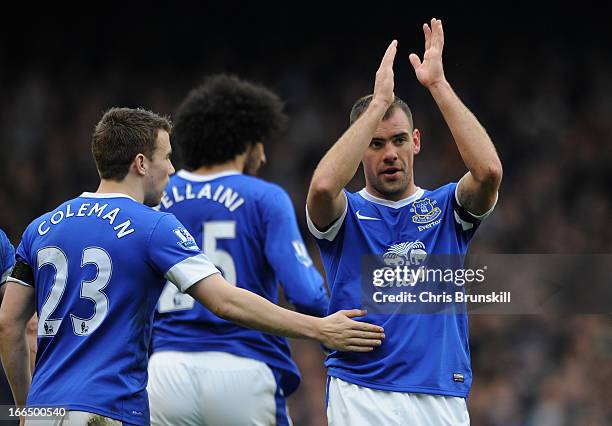 Darron Gibson of Everton is congratulated by his team-mate Seamus Coleman after scoring the opening goal during the Barclays Premier League match...