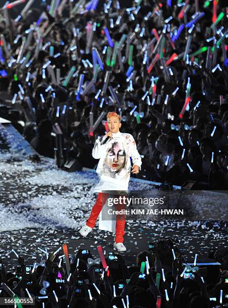 South Korean rapper G-Dragon performs during the "Gangnam Style" star Psy's concert "Happening" in Seoul on April 13, 2013. South Korean pop star Psy...