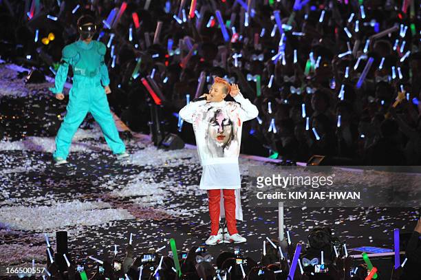 South Korean rapper G-Dragon performs during the "Gangnam Style" star Psy's concert "Happening" in Seoul on April 13, 2013. South Korean pop star Psy...