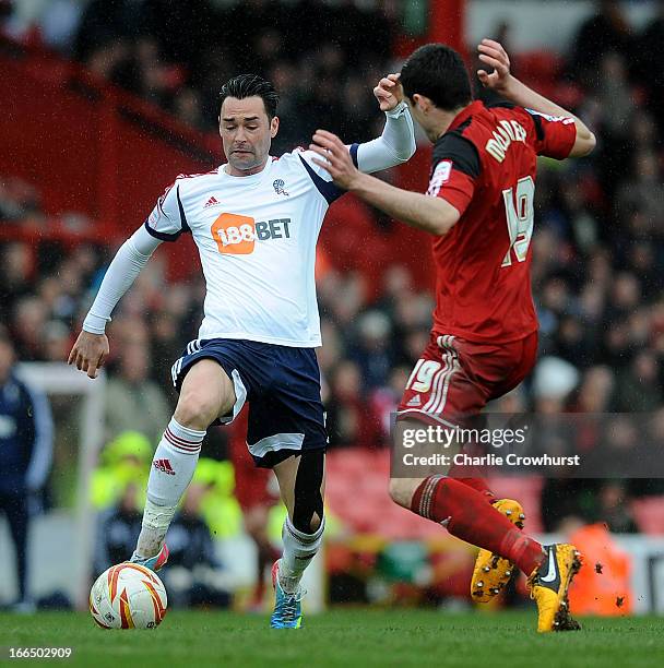 Chris Eagles of Bolton looks to attack Bristol City's Brendan Moloney during the npower Championship match between Bristol City and Bolton Wanderers...