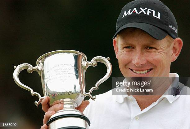 Steve Allan of Australia celebrates his Australian Open win with the Stonehaven Cup after the final round of the Holden Australian Open at the...
