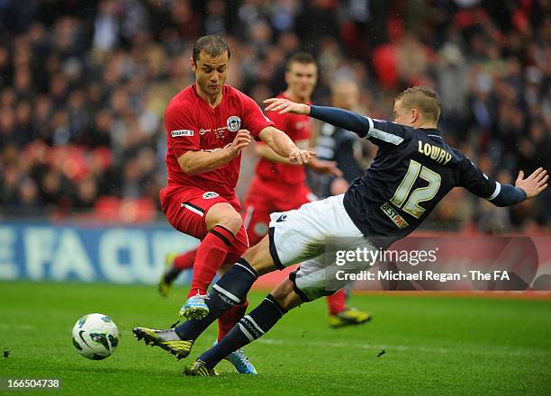 Shaun Maloney of Wigan Athletic is tackled by Shane Lowry of Millwall during the FA Cup with Budweiser Semi Final match between Millwall and Wigan...