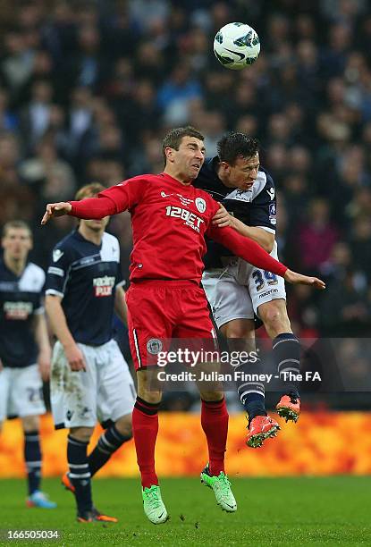 James McArthur of Wigan Athletic and and Sean St Ledger of Millwall go up for a header during the FA Cup with Budweiser Semi Final match between...
