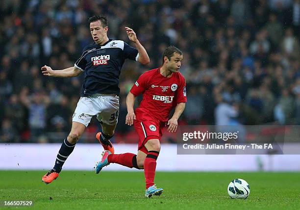 Sean St Ledger of Millwall and Shaun Maloney of Wigan Athletic compete for the ball during the FA Cup with Budweiser Semi Final match between...
