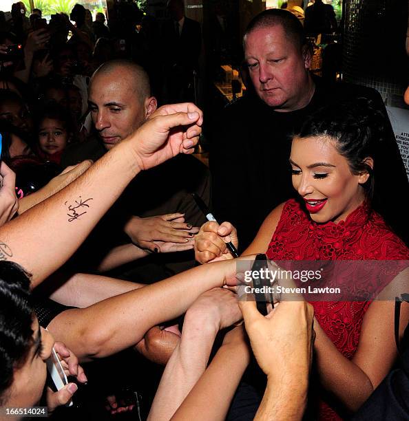 Television personality Kim Kardashian arrives at the Kardashian Khaos store at The Mirage Hotel & Casino for a fan meet-and-greet to support her...