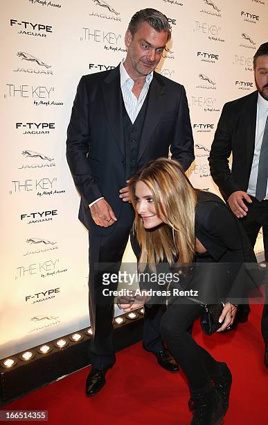 Ray Stevenson reacts as Sophia Thomalla passes him upon her arrivat at the Jaguar F-Type short film 'The Key' Premiere at e-Werk on April 13, 2013 in...