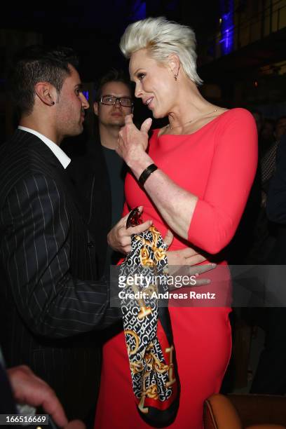 Brigitte Nielsen chats with her husband Mattia Dessi during the Jaguar F-Type short film 'The Key' Premiere at e-Werk on April 13, 2013 in Berlin,...
