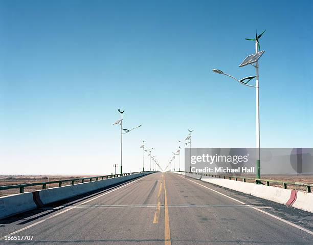 solar and wind generated street lighting - solar street light stock pictures, royalty-free photos & images