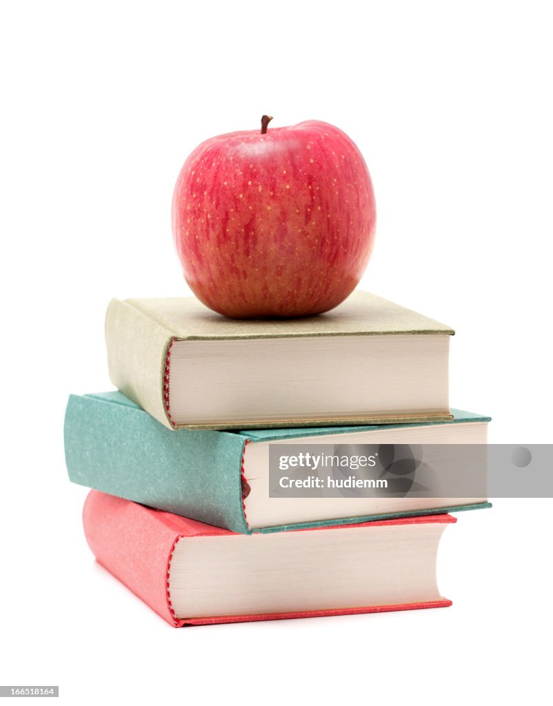 Apple on a Stack of Book isolated on white background