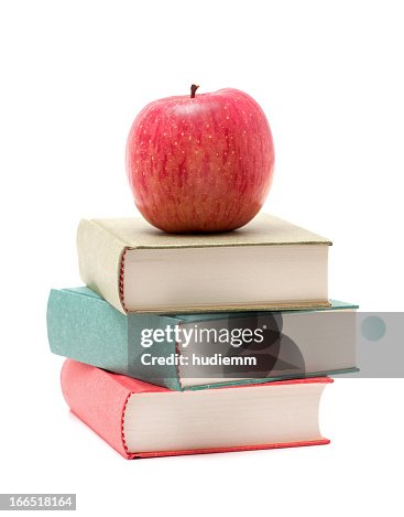 Apple on a Stack of Book isolated on white background Apple on a Stack of Book isolated on white background