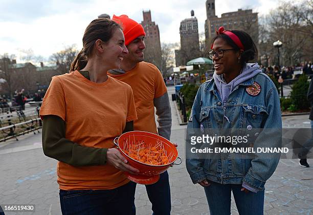 Importers and supporters offers samples of French cheese Mimolette to pedestrians during an event to support the import in the US of the 17th...
