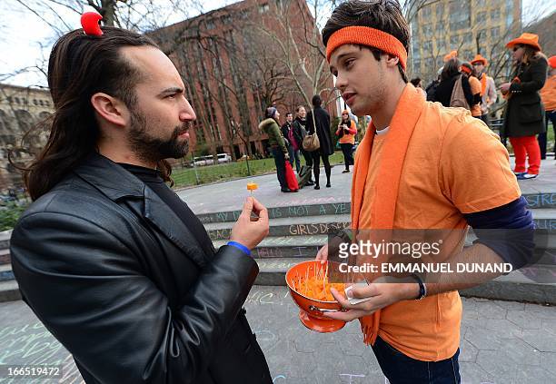 Importers and supporters offers samples of French cheese Mimolette to pedestrians during an event to support the import in the US of the 17th...