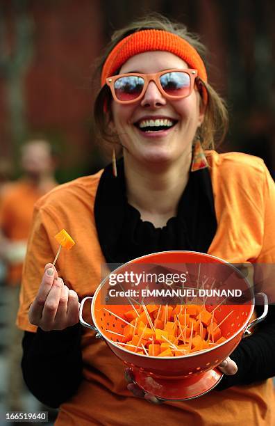 Importers and supporters offers samples of French cheese Mimolette to pedestrians during an event to support the import in the US of the 17th...