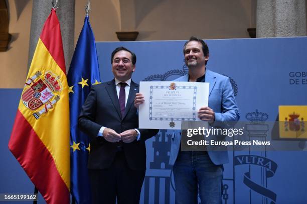 The acting Minister of Foreign Affairs, European Union and Cooperation, Jose Manuel Albares, presents the diploma to the chef Fernando Moran, during...