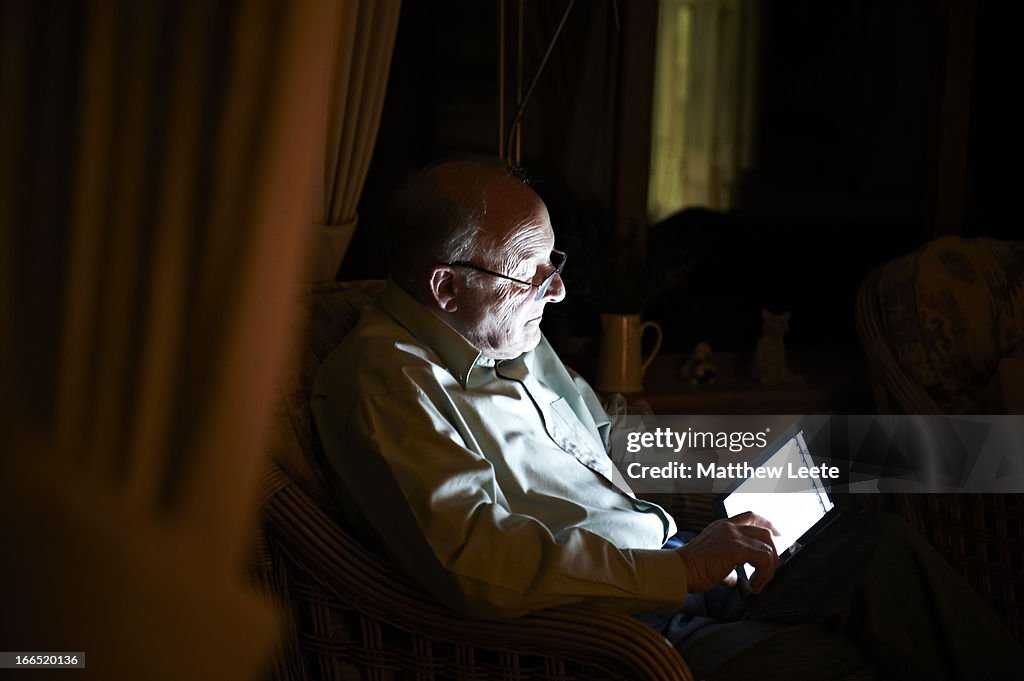 Pensioner using tablet
