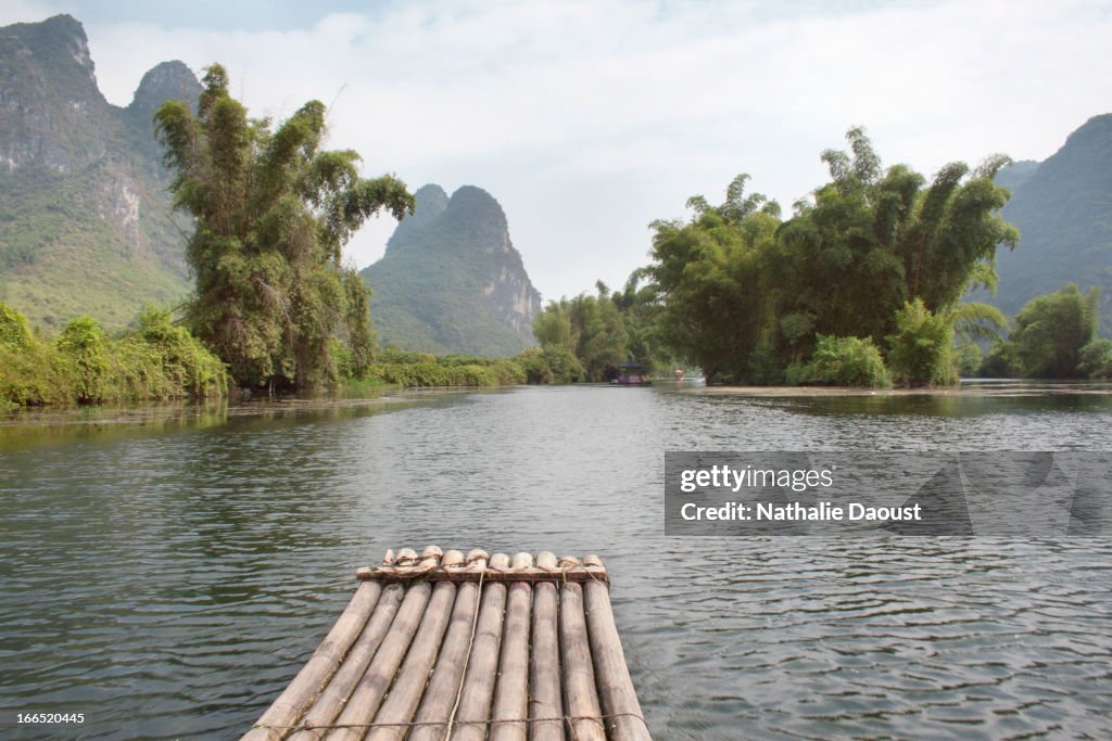 Ride on a boat in the calm waters of Li River