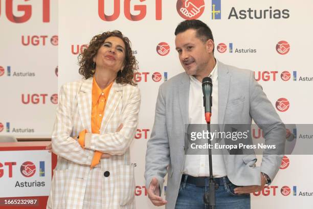 The Secretary General of UGT Asturias, Javier Fernandez Lanero speaks alongside the acting Minister of Finance and Public Function, Maria Jesus...