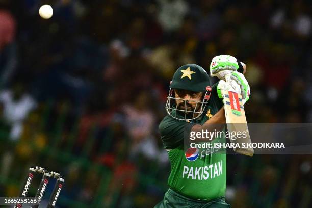 Pakistan's captain Babar Azam watches the ball after playing a shot during the Asia Cup 2023 Super Four one-day international cricket match between...