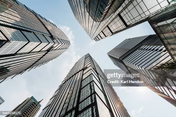 looking up at city buildings - rascacielos fotografías e imágenes de stock